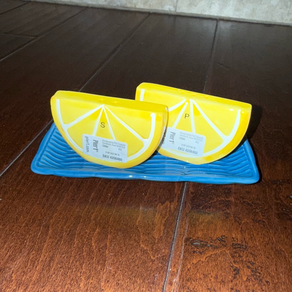 Pier 1 Lemon Wedge Salt & Pepper Shakers with blue tray.